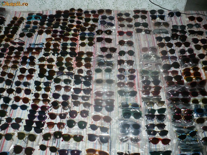 LOT DE PESTE 20.000 PERECHI OCHELARI DE SOARE SI RAME DE OCHELARI foto mare
